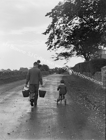 MAN WITH BUCKETS, CHILD ON TRIKE